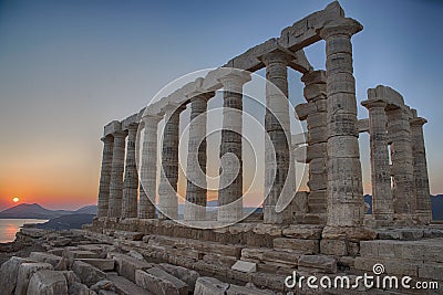 Horizontal shot of ancient Hellenistic temple columns during sunset Stock Photo