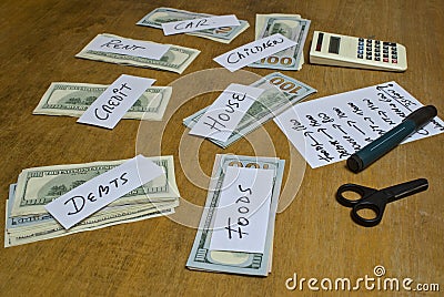 Horizontal shot of expense planning with a calculator, and money stacks - personal finance Stock Photo