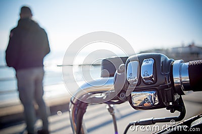 Horizontal View of Close Up of a Chrome Handle Bar On Blur Background Stock Photo