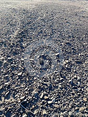 Horizontal view of desert rocks ground looking into the distance Stock Photo