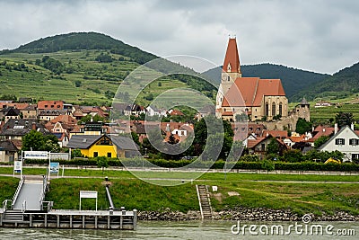 Horizontal view of the village of Weissenkirchen built along the Danube River. Editorial Stock Photo