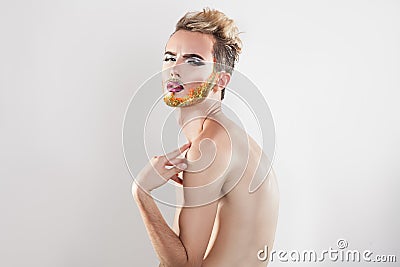 Horizotnal portrait of beautiful gay model with multicolor beard Stock Photo