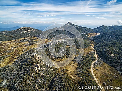 The Horn Peak and winding road, Mount Buffalo National Park - be Stock Photo