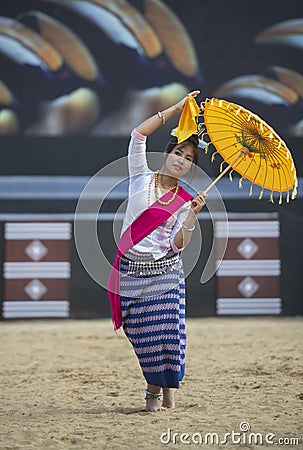 Hornbill Festival.Nagaland,India:2nd December 2013 : Female Dancer performing Tribal Dance with traditional Umbrella at Hornbill Editorial Stock Photo