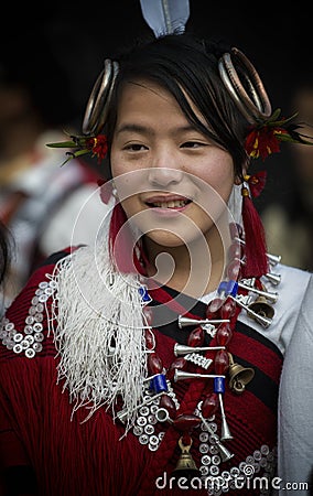 Hornbill Festival.Nagaland,India:1st December 2013 :Young Naga Girl in a traditional Attire at Hornbill Festival. Editorial Stock Photo