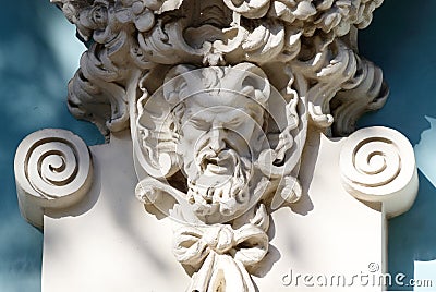 Horned head of Satyr,old house decoration,greek mythology Stock Photo