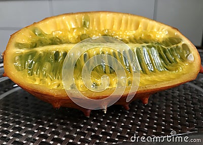 A Horned Melon or Kiwano, also the African Horned Cucumber or Melon, Jelly Melon, Hedged Gourd, or Melano is a Beautiful Fruit Stock Photo