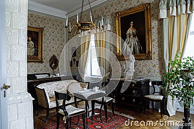 Horovice castle interior, Baroque chateau, carved black wooden furniture, Empire style bedroom, table and chairs, Czech Republic Editorial Stock Photo
