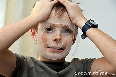 Horrified teenager boy Stock Photo