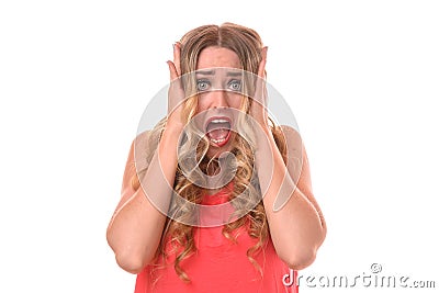 Horrified young woman clutching her head Stock Photo