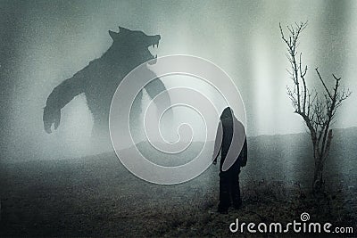 A horror concept of a man looking at a giant werewolf figure on a moody mountain side. With a grunge edit Stock Photo