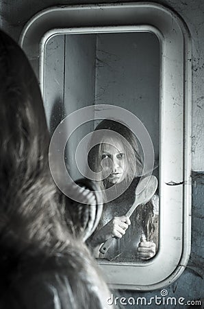 Horror girl in the mirror Stock Photo