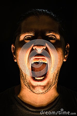 Horror scene with screaming scary human face - Halloween Stock Photo