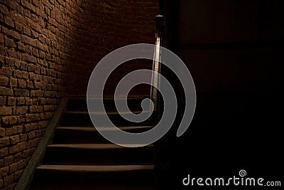 Horror style dark hall and stairs path way corridor indoor space and brick wall background in photography with lights and shadows Stock Photo