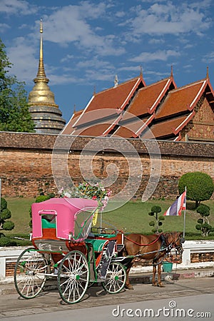 Horse carriage park in front of temple Wat Phra That Lampang Luang in Lampang province Editorial Stock Photo