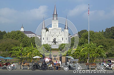 Horse Carriage and tourists in front of Andrew Jackson Statue & St. Louis Cathedral, Jackson Square in New Orleans, Louisiana Editorial Stock Photo