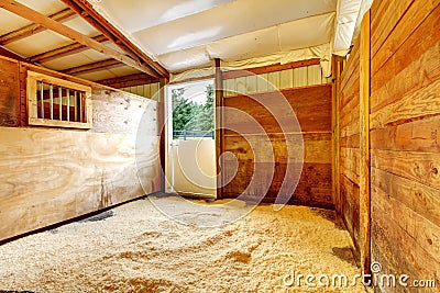 Horse farm empty stable interior. Stock Photo