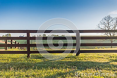 Horse Fence Across Field Stock Photo