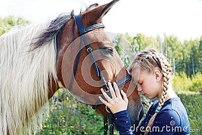 Horse and horse woman - little girl and her best friend Stock Photo