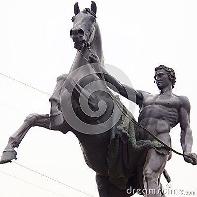 Horse and man. Anichkov bridge Stock Photo