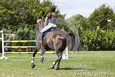 Horse and rider in jump course Editorial Stock Photo