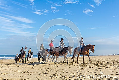 horse riders on the beach on beautiful sunny day Editorial Stock Photo