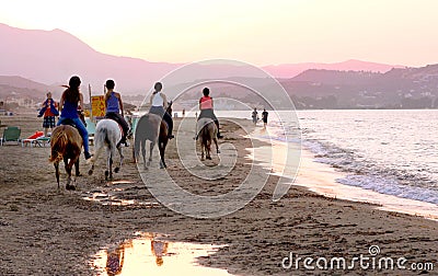 Horse riders on the beach Editorial Stock Photo