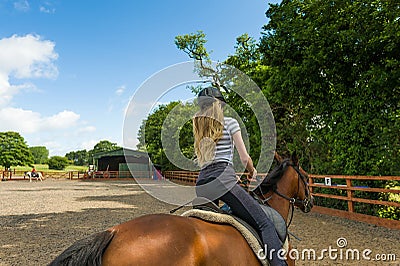 Horse riding at paddock Stock Photo