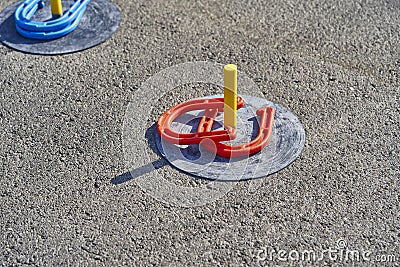 Horse shoes game in the asphalt Stock Photo