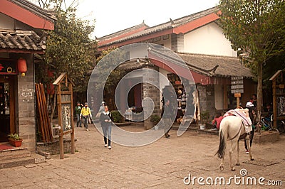 Horse walk in evening ,Shuhe ancient town. Editorial Stock Photo