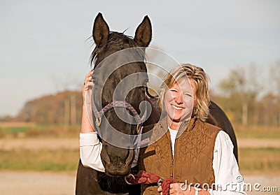 Horse and Woman Laughing Stock Photo