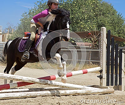 Horseback Rider Jumping Stock Photo