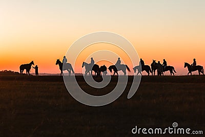 Horses Riders Silhouetted Dawn Stock Photo