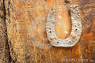 Horseshoe nailed on a door Stock Photo