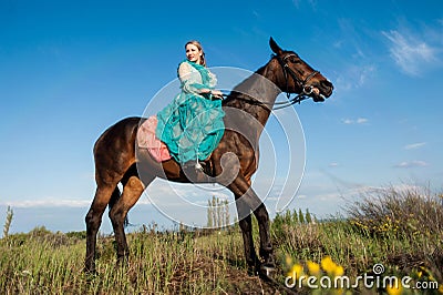 Horsewoman and blue sky Stock Photo