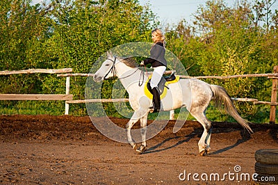 Horsewoman at hippodrome and blue sky Stock Photo