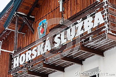 Horska Sluzba wooden hut and logo, Czech mountain rescue service, Czech Republic Editorial Stock Photo