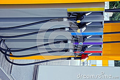 Hoses for pouring gasoline on a filling station column Stock Photo