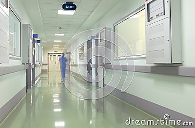 Hospital corridor with blurred figures of the medical staff Stock Photo