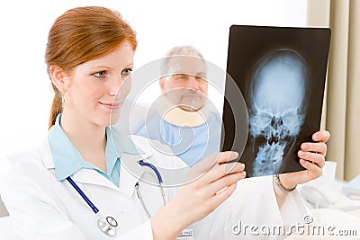 Hospital - female doctor examine patient x-ray Stock Photo