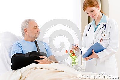 Hospital - female doctor examine senior patient Stock Photo