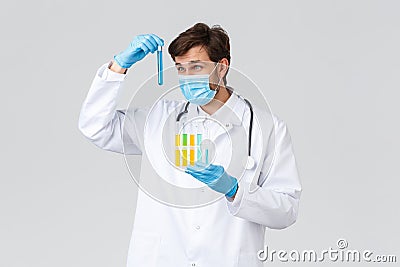 Hospital, healthcare workers, covid-19 treatment concept. Serious doctor or lab technician trying find vaccine to fight Stock Photo