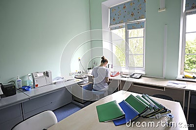 At a hospital laboratory. Lab technician performing analysis of blood samples with gas-electrolyte analyzer Editorial Stock Photo