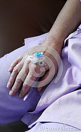 Hospital procedure cannula in hand Stock Photo