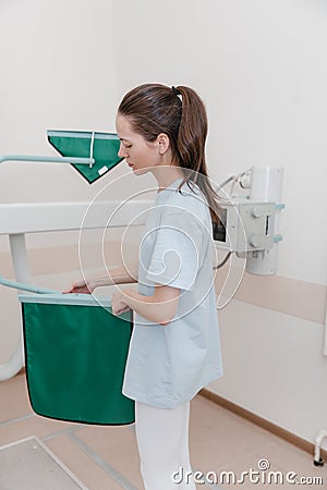 Hospital Radiology Room. Xray machine for fluorography. Woman patient scanning chest, heart or lungs in clinic office Stock Photo
