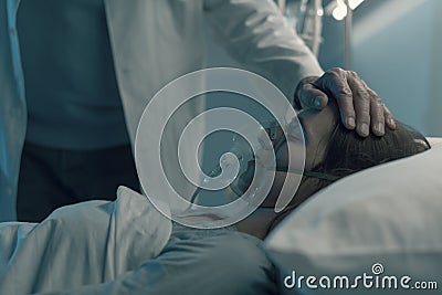Hospitalized patient lying in a bed Stock Photo
