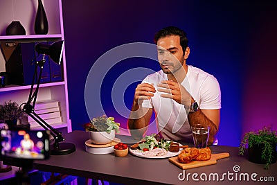 Host channel presenting fresh vegetables in special dish. Surmise. Stock Photo