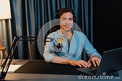 Broadcaster talking on live application searching on laptop. Pecuniary. Stock Photo