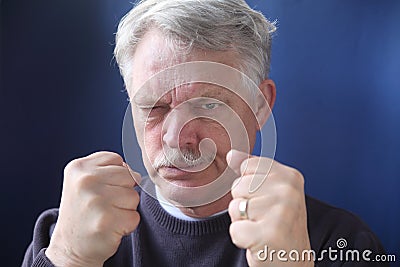 Hostile and combative senior man Stock Photo