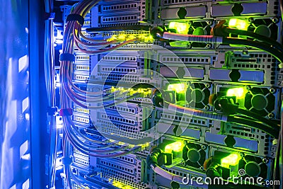 Hosting platform for modern Internet resources. Rack with server data storage equipment. Many network cables are connected to the Stock Photo